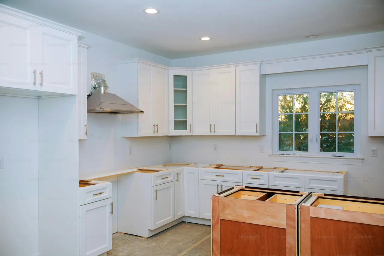Custom kitchen cabinets in installation — illustrating storage layouts